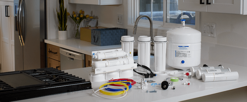 VIVA21 Water filtration system components on a kitchen counter